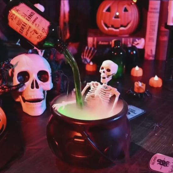 Halloween floating potion bottle diffuser with green fog inside wizard bowl